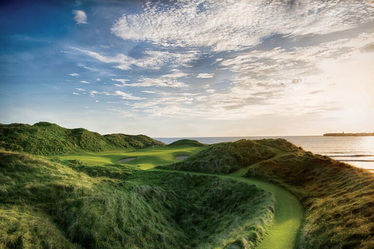 Image displaying the 11th hole view up the fairway towards the green and surrounding bunkers at Lahinch Golf Club, County Clare, Ireland