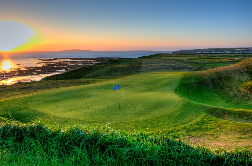 Image overlooking the 6th green at sunset on the Cashen Golf Course at Ballybunion, County Kerry, Ireland