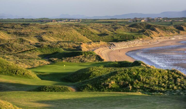Image depicting the 11th Tee looking down at the green and adjacent beach on the old Golf Course at Ballybunion, County Kerry, Ireland