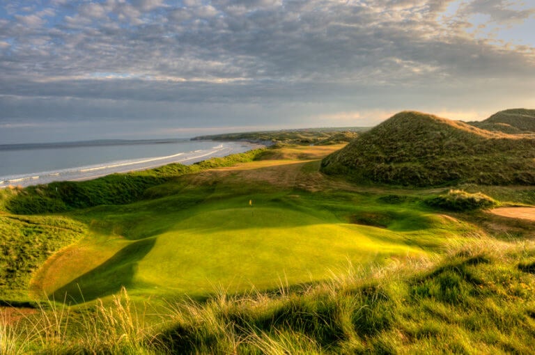 Image overlooking the 17th green and distant beach on the Old Golf Course at Ballybunion, County Kerry, Ireland
