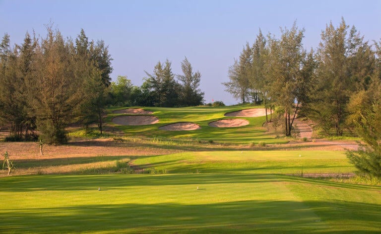 Image of the par-3 11th hole playing uphill at Montgomerie Links Vietnam Golf Course, Da Nang, Vietnam, Asia