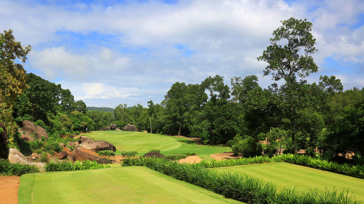 Image of the par-3 11th hole tee box looking down at the green at Laguna Lang Co Golf Club, Da Nang, Vietnam