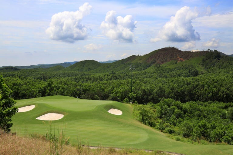 Image of the raised 12th green and surrounding bunkers at Ba Na Hills Golf Club, Da Nang, Vietnam