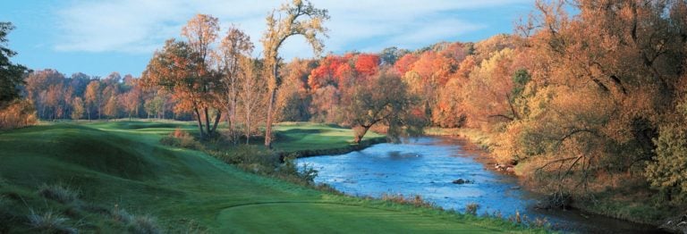 Image displaying autumn leaves on the trees at Blackwolf Run River Golf Course, Destination Kohler, Sheboygan, Wisconsin, USA