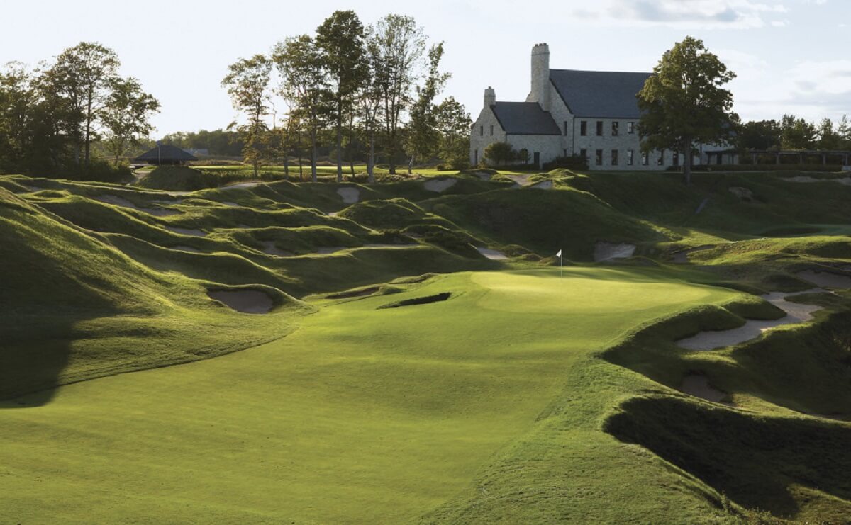 Image of the approach to the 9th green with the clubhouse in the background, Whistling Straits, Destination Kohler, Sheboygan, Wisconsin, USA