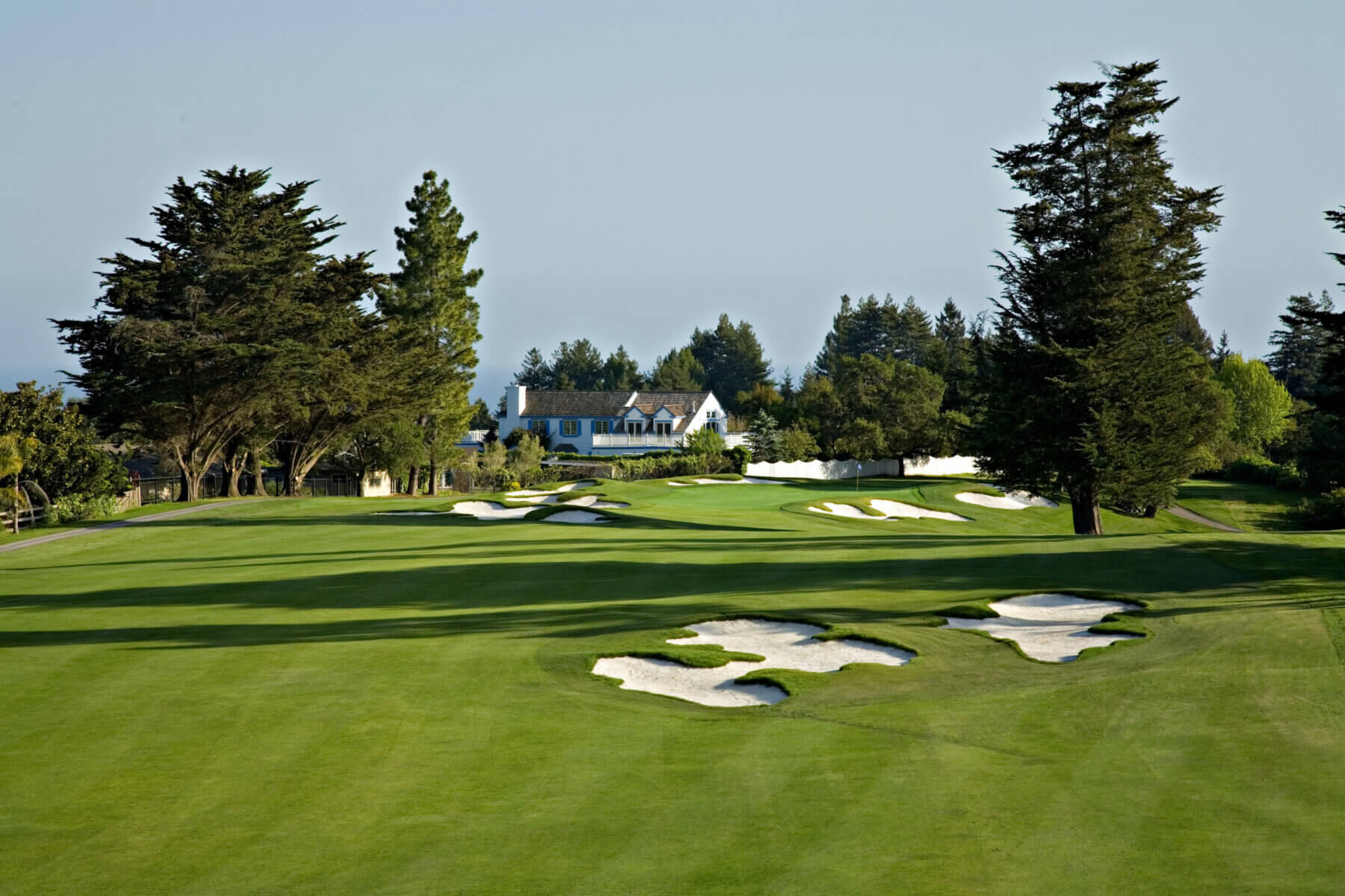 Image of the clubhouse and strategic bunkers oat Pasatiempo Golf Course, California, USA