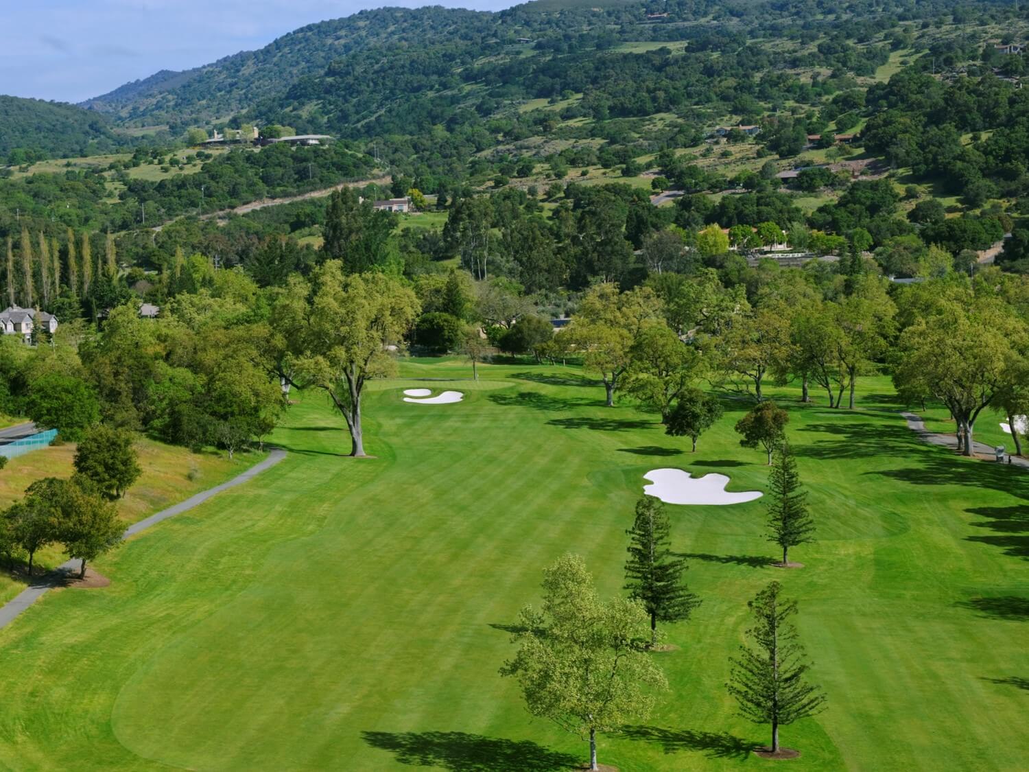 Aerial view of green fairways and white sand bunkers at Silverado Golf Resort