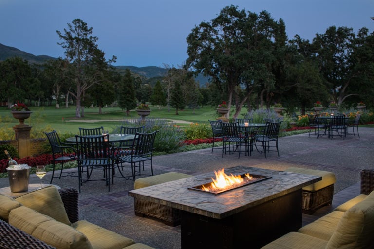 Outdoor fireplace and patio overlooks the Silverado Golf Resort Course