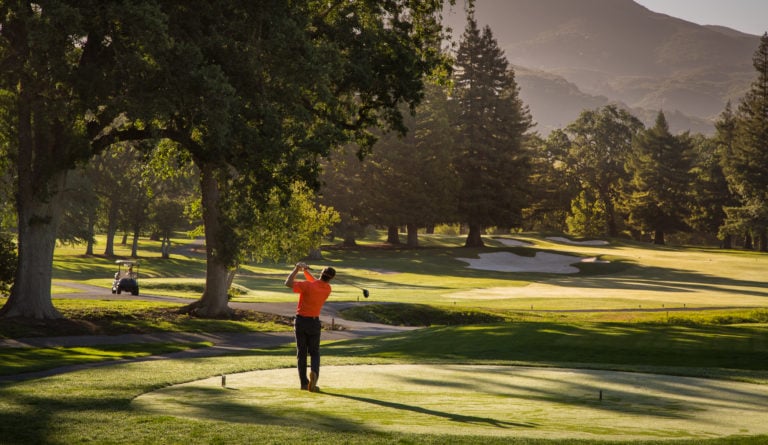 A golfer tees off on the Silverado Golf Resort Course