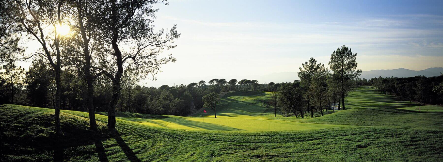 Landscape view of the tenth green looking back down the fairway