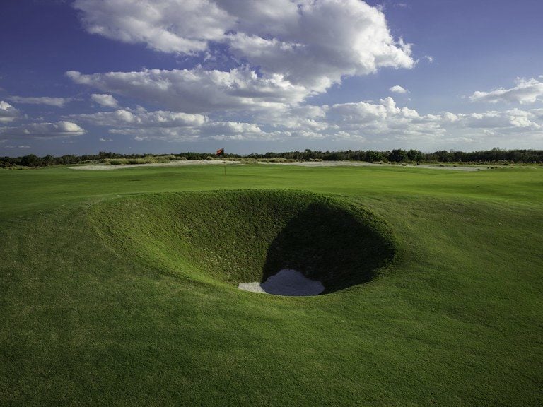 Large indented bunker on the Black Golf Course at Streamsong Golf Resort in Florida
