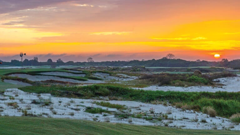 A golden sun leaves the golf course without light at Streamsong Golf Resort in Florida
