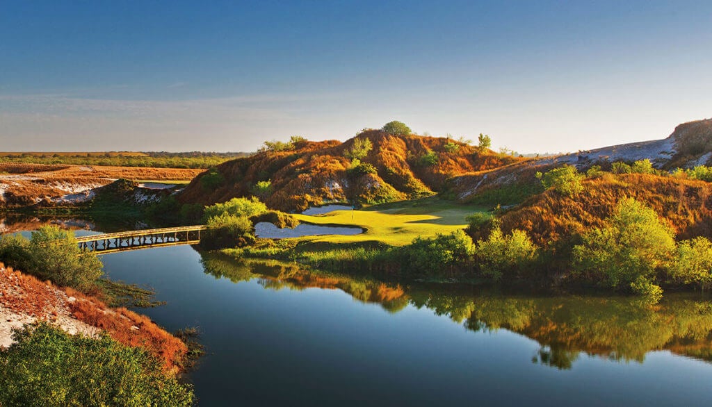 Overlooking the seventh green surrounded by a lake and high dunes at Streamsong Golf Resort