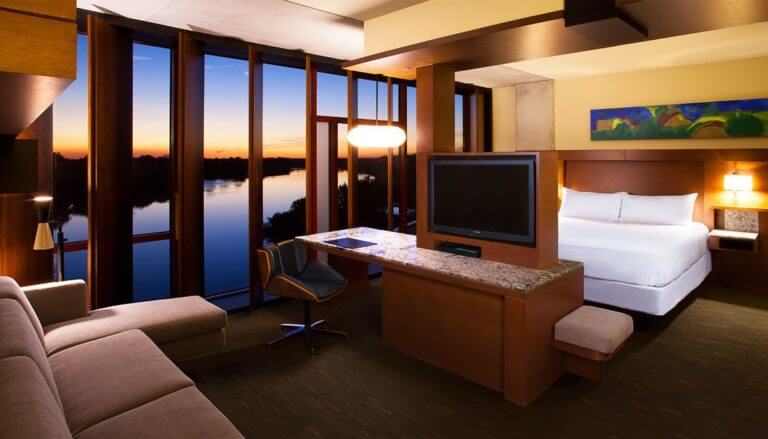 Twilight view of lights shining in a bedroom at Streamsong golf Resort in Florida, USA