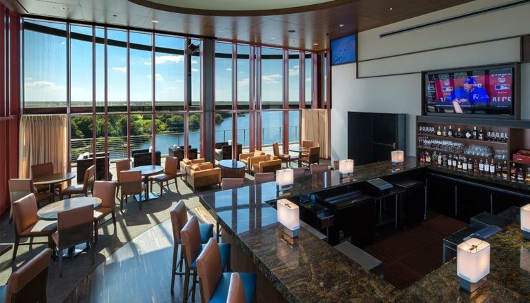 Interior view of the bar and restaurant overlooking a lake at the Golf Resort in Streamsong, Florida
