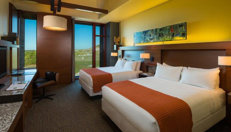 Interior view of a twin bedroom at Streamsong clubhouse accommodation in Florida