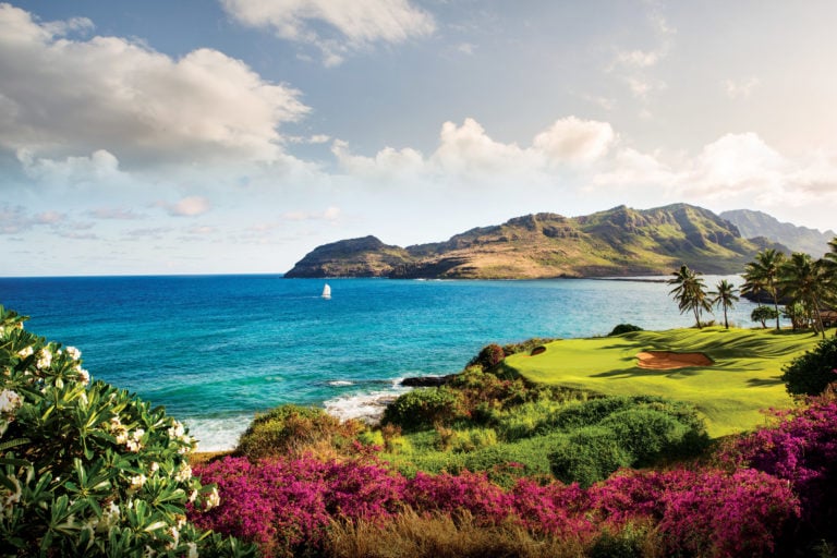 The Ocean Course at Hokuala overlooks the Pacific Ocean and sailing boats in Hawaii
