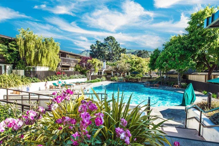 Resort guests swim in the pool at Quail Lodge Golf Resort in California
