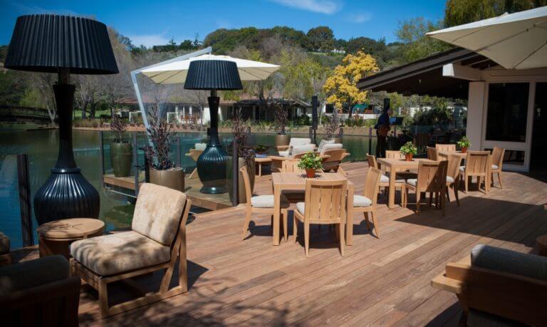 Empty dining area overlooks a lake at Quail Lodge in California