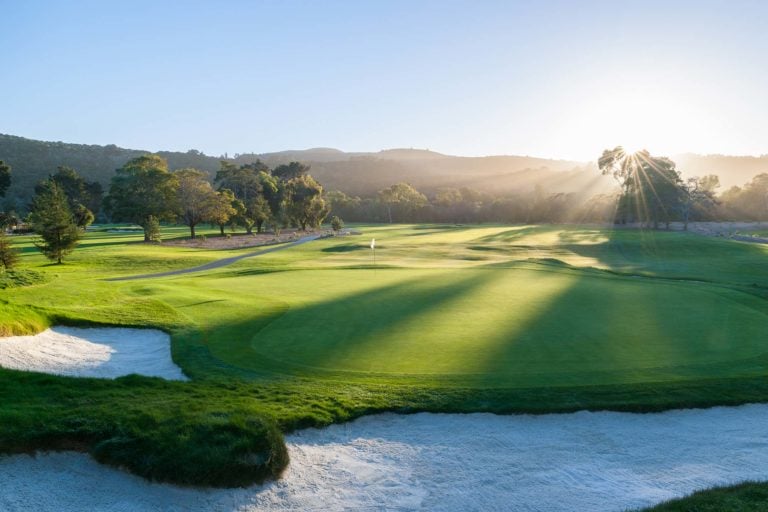Dawn light breaks shadows on the sixteenth green of the Quail Lodge Golf Course in California