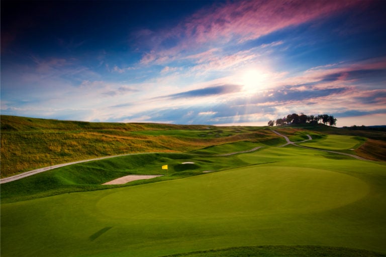 A long fairway leads into an oval golf green at French Lick Golf Resort, Indiana