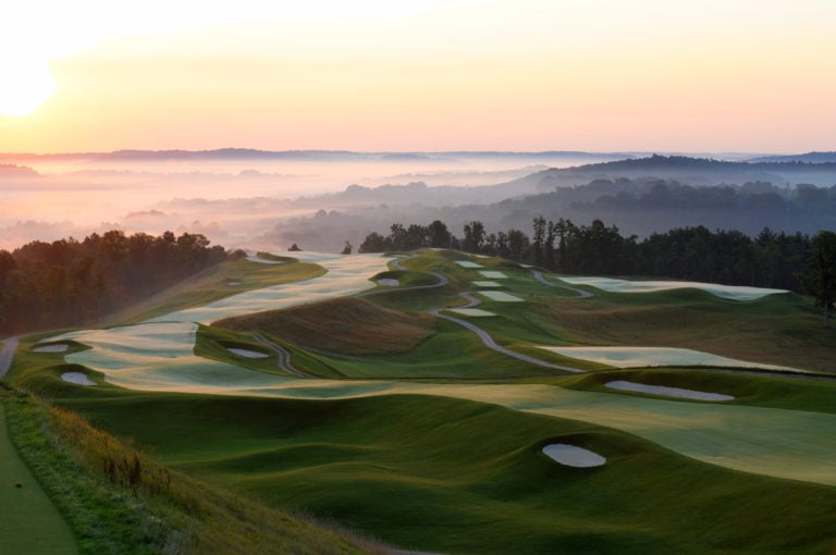 Dawn casts golden morning sun over the Pete Dye Golf Course at French Lick Golf Resort, Indiana