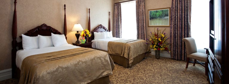 Two double beds and large bedroom space await travelling golfers at French Lick Golf Resort, Indiana
