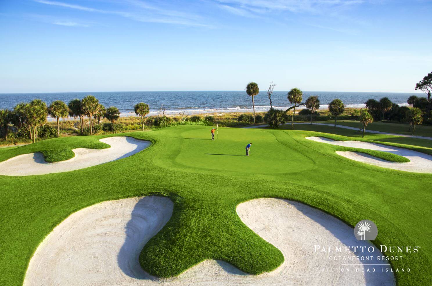 Two golfers putt on the tenth green at Palmetto Dunes Golf Course, Hilton Head