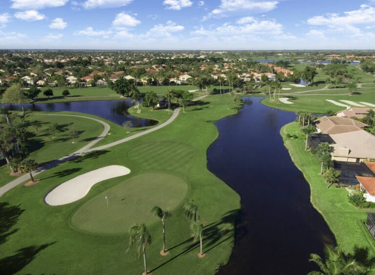 Aerial view of resort buildings and the Fazio Course at PGA National Golf Club