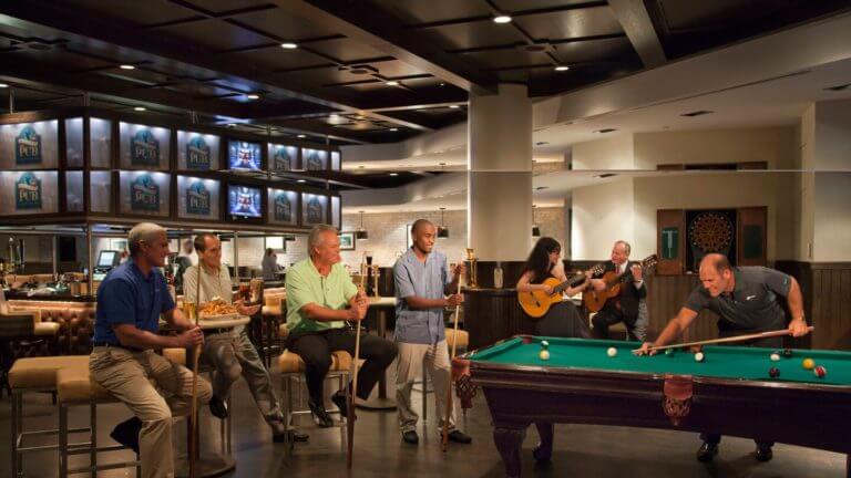 Americans play pool and guitars at Alice & Pete's Pub at Sawgrass Marriott Golf Resort & Spa, Florida