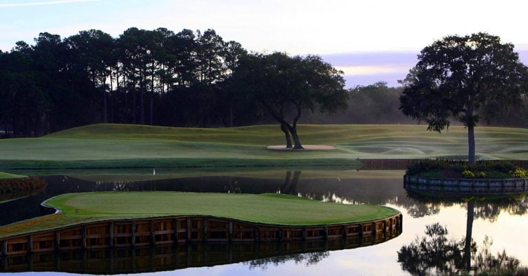 Dawn mist rises off the seventeenth hole of the TPC Sawgrass Golf Course