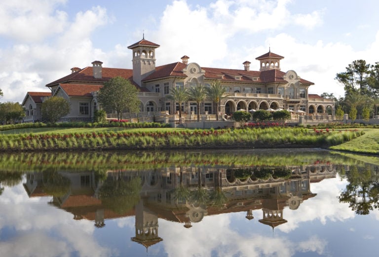 External view over a lake at the TPC Sawgrass Clubhouse building in Florida