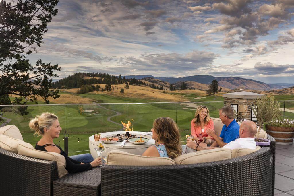 Golfers dine overlooking the golf complex at the clubhouse at Predator Ridge Golf Resort, Canada