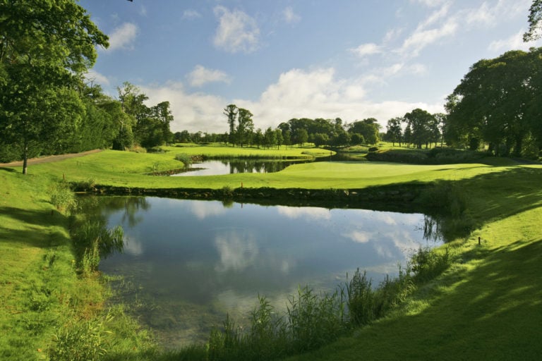 Landscape view of multiple lakes and a golf green on the Arnold Palmer golf course at The K Club, Ireland