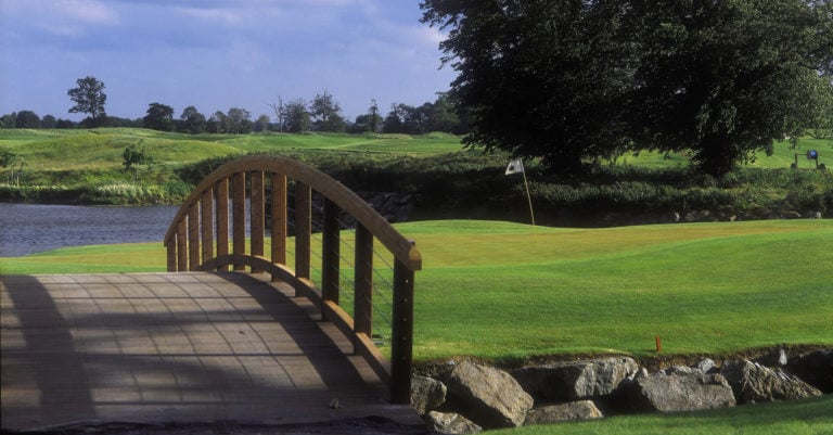A wooden Swilcan bridge connects the South Course eighteenth hole at The K Club Resort