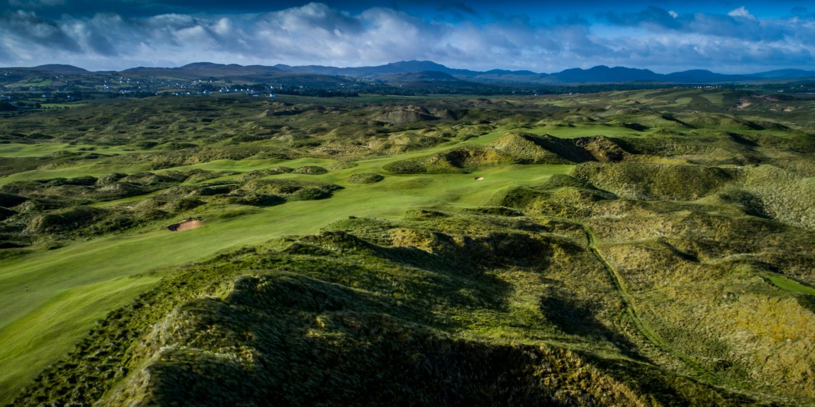 Overlooking the undulating ground of the Old Tom Morris Golf Course fifth fairway at Rosapenna Golf Resort, Ireland
