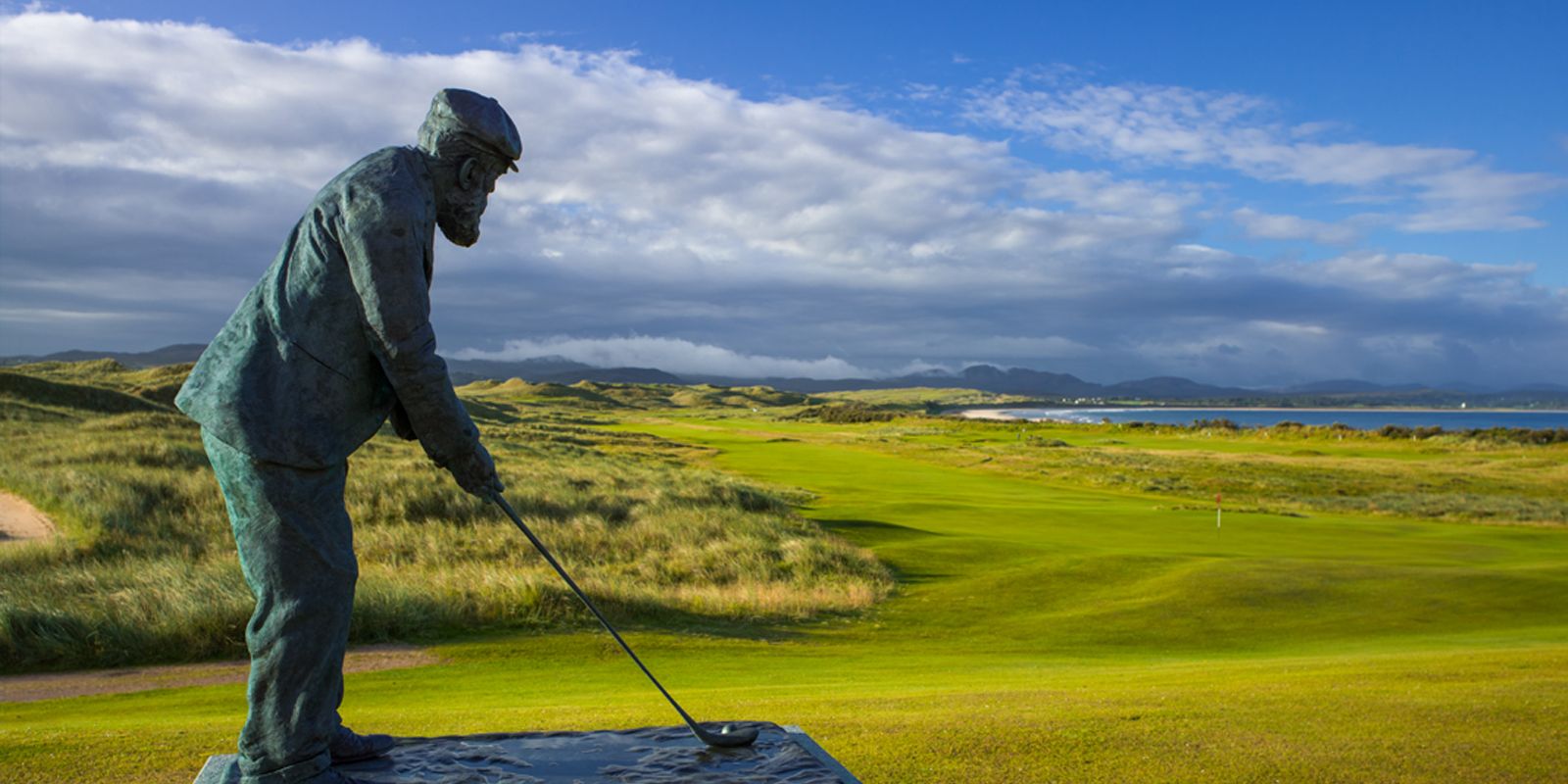 A statue of Golf architect and legend Old Tom Morris stands in front of the golf courses at Rosapenna Golf Resort, Ireland