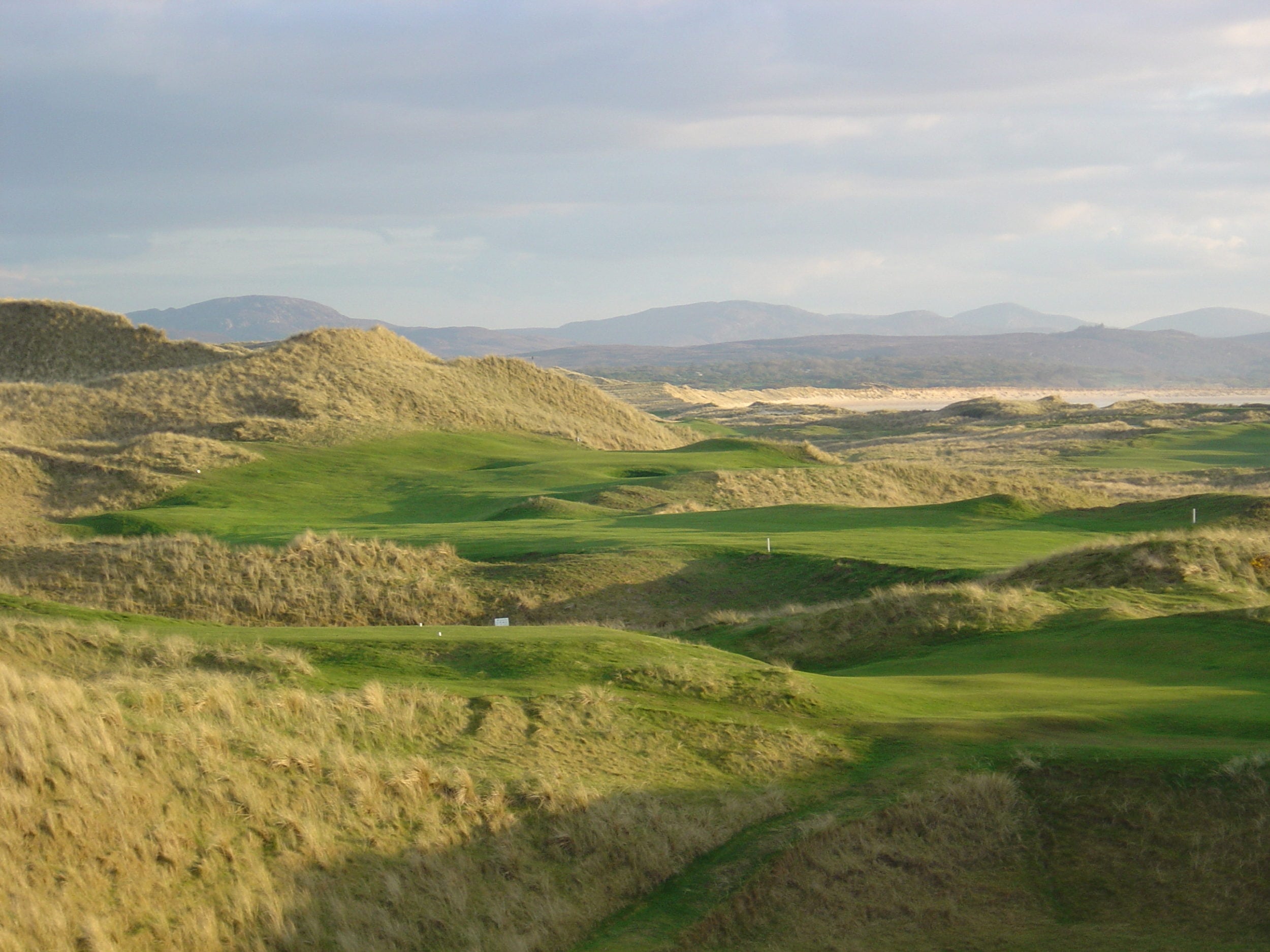 Long grass and undulating hills comprise the Sandy Hills golf course at Rosapenna Golf Resort, Ireland