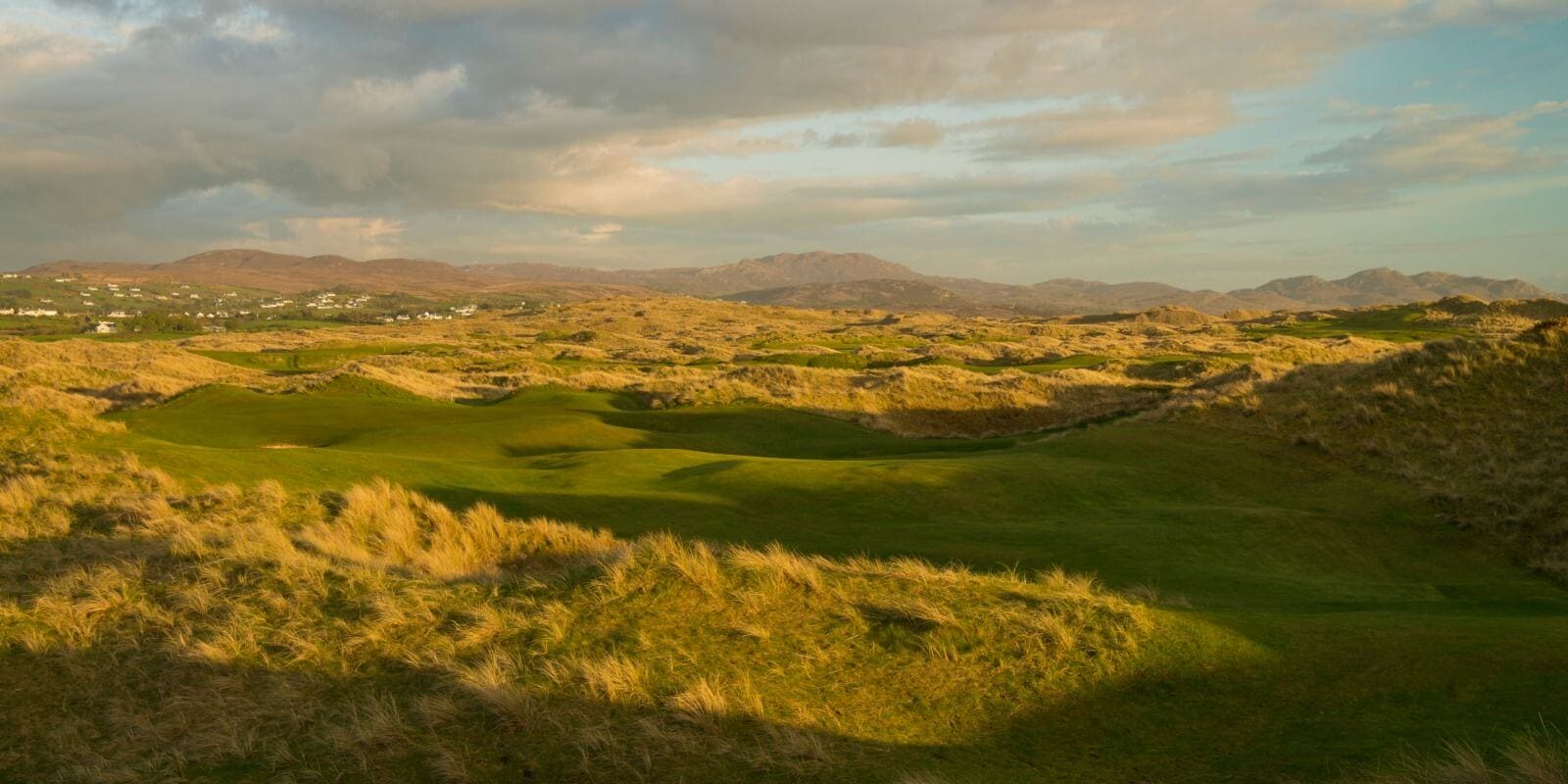 Dusk view of undulating sand dunes at Rosapenna Golf Resort, Ireland