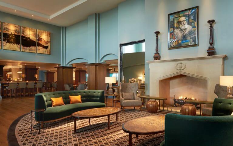 A large open fireplace and expansive seating area adorn the Fairmont lobby in St Andrews