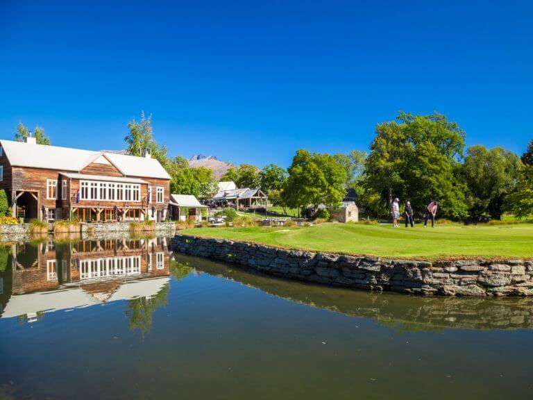 View of the 18th green and background restaurant at Millbrook Resort New Zealand