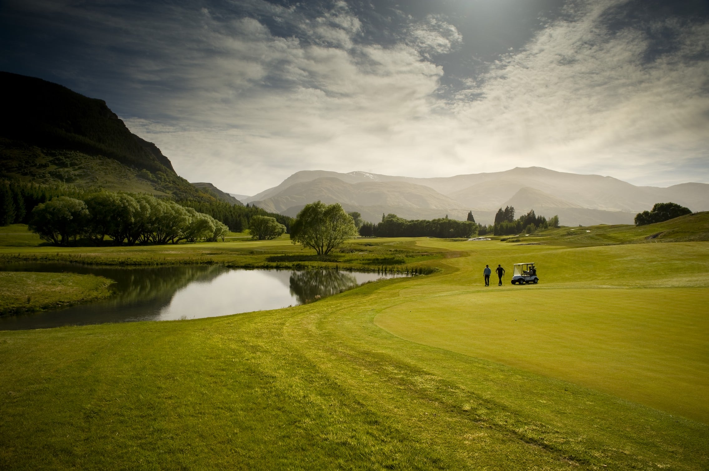 Image displaying golfers playing the Millbrook Coronet Nine Course in New Zealand