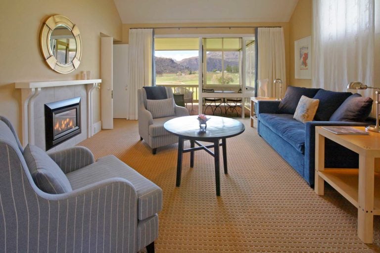 Image displaying the inside of a lounge room and view of the Millbrook Resort Golf Course, New Zealand