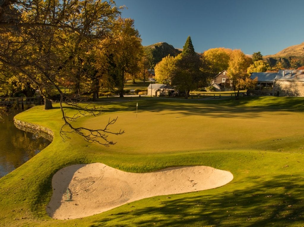 Image overlooking a green-side bunker on the golf course at Millrbrook Resort, New Zealand