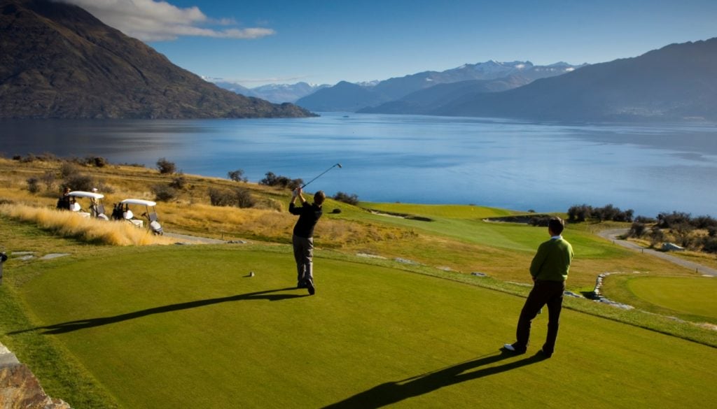 Image displaying travelling golfers teeing off at Jack's Point Golf Course, Queenstown