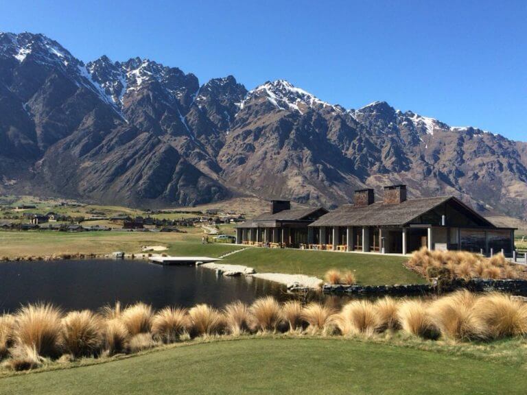 Daylight image of Jack's Point Clubhouse and Remarkables Mountain Range in New Zealand