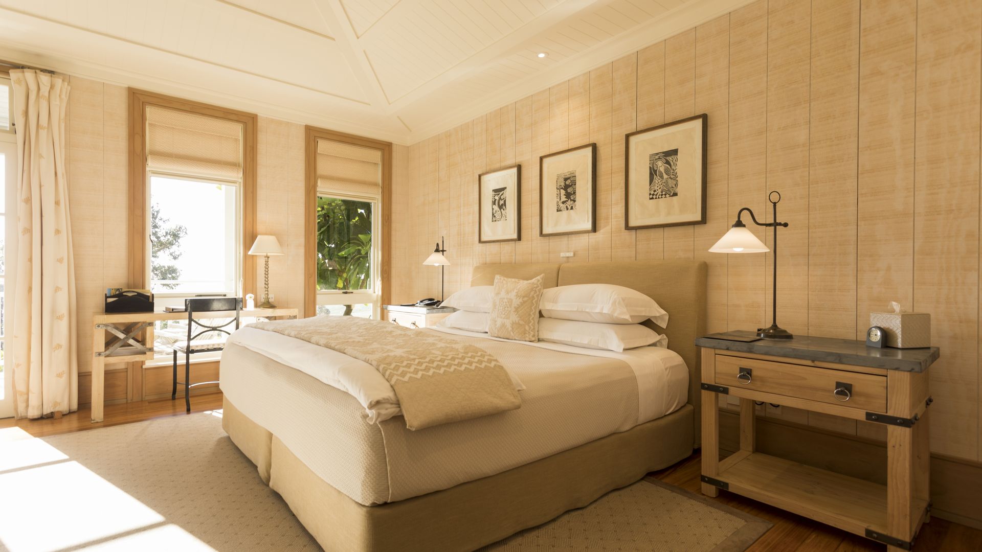 Image of a king bedroom at Kauri Cliff's Deluxe Suite, New Zealand's North Island