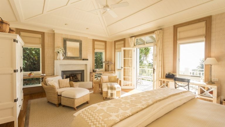 Image displaying the interior of a master bedroom at Kauri Cliffs Golf Resort
