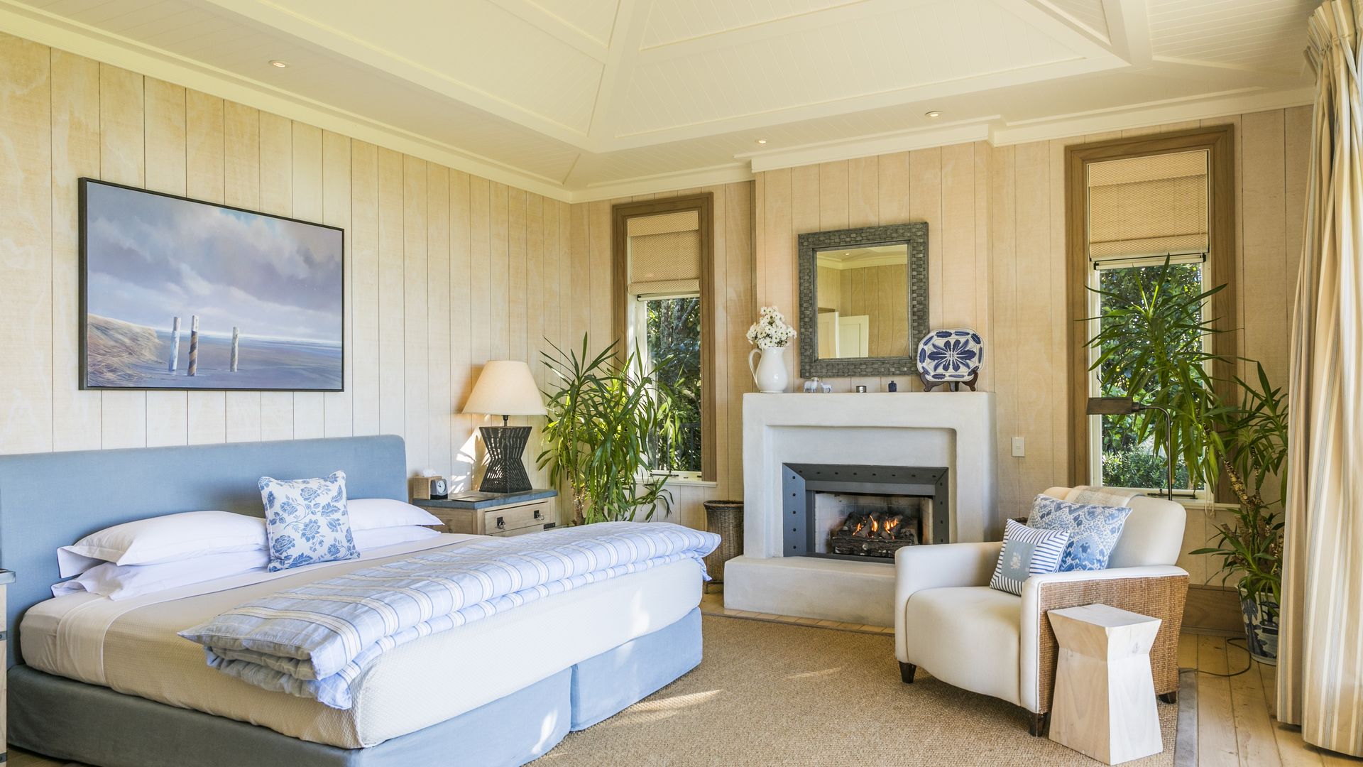 Image displaying a fireplace inside the Owner's Cottage bedroom at Kauri Cliffs Golf Resort