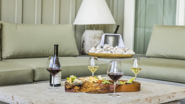 Image of wine and cheese board inside Kauri Cliffs Owner's Cottage, Matauri Bay